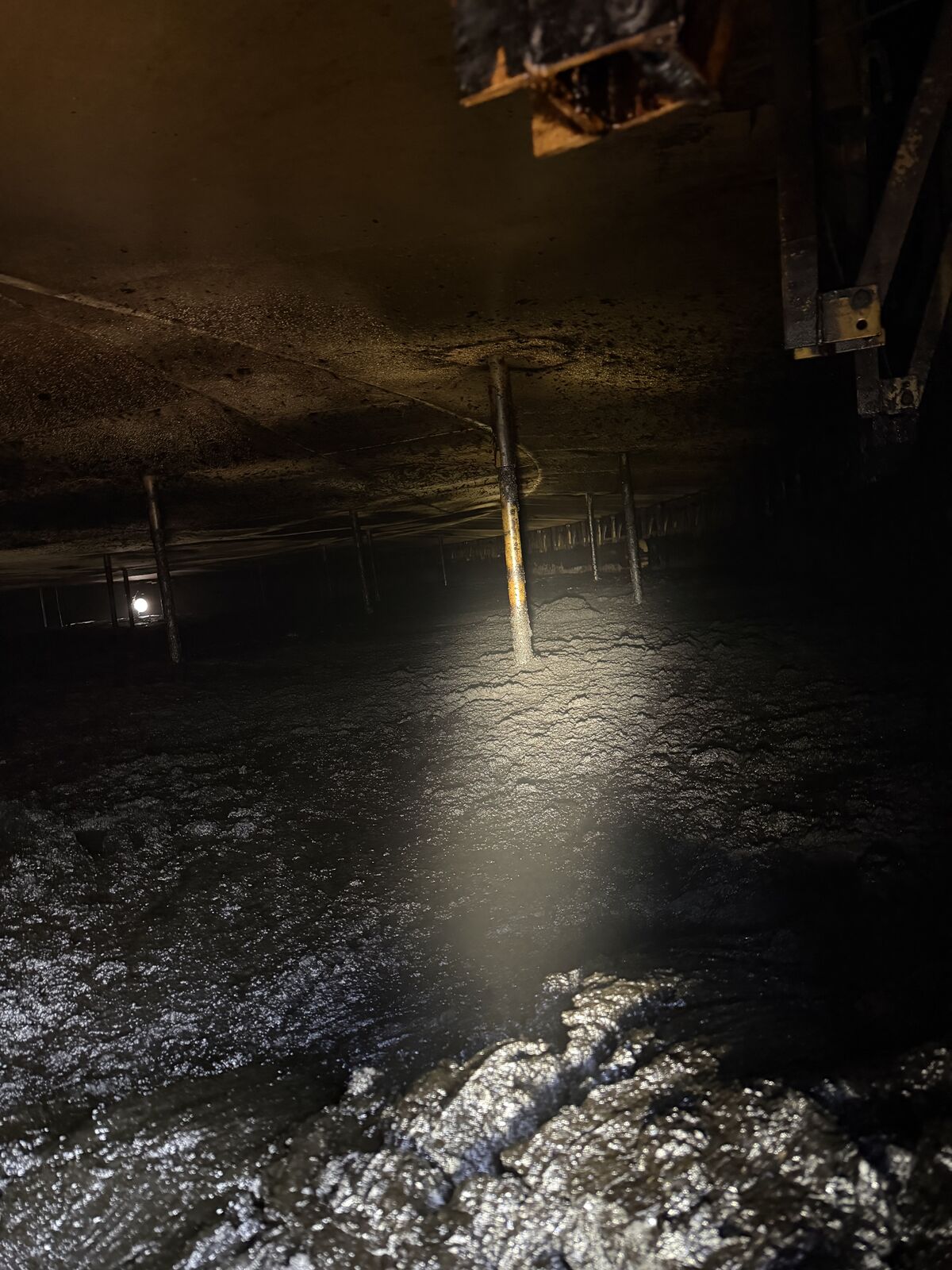 Floating-roof tank interior with thick sludge buildup