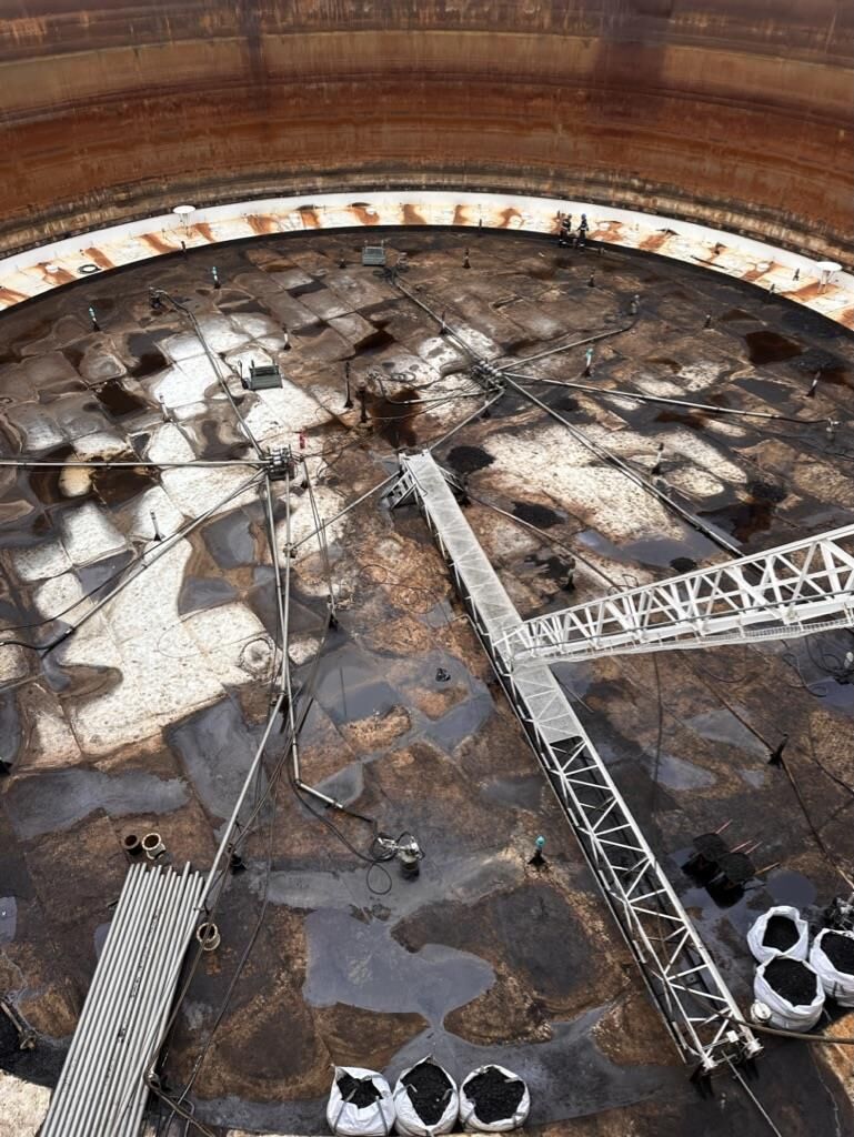 Tank floor with crane access ramp during sludge removal